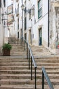 Narrow cobblestone stairs in Lisbon Royalty Free Stock Photo