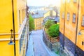 The narrow cobblestone street Bastugatan in Sodermalm with medieval houses in Stockholm at summer sunny day.