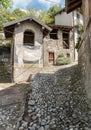 Narrow cobblestones streets with paintings on walls in ancient painted village Arcumeggia in province of Varese, Italy