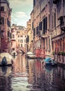 Narrow colorful street with parked boats, Venice, Italy Royalty Free Stock Photo
