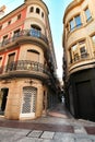 Narrow and colorful streets, facades and balconies in Elche city