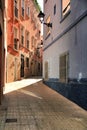 Narrow and colorful streets, facades and balconies in Elche city