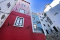 Narrow and colorful streets of Lisbon in a cloudy day Royalty Free Stock Photo