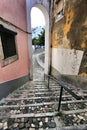 Narrow and colorful streets of Lisbon in a cloudy day Royalty Free Stock Photo