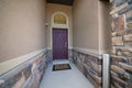 Narrow concrete entrance of a house with a security camera