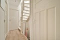 Narrow corridor in a modern white-decorated house Royalty Free Stock Photo