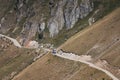 On narrow curvy road drives truck in the mountains. Summer in south France