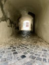 Narrow dark passage in the old town of medieval Feldkirch. Vorarlberg, Austria. Royalty Free Stock Photo