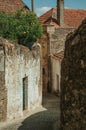 Narrow deserted alley with worn plaster walls Royalty Free Stock Photo