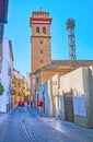 The tall brick bell tower of San Andres Church, Albaicin, Granada, Spain