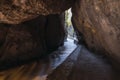 Narrow entrance to the cave between mountains on the route of the river Monachil, in Los Cahorros, Granada,