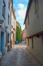 Narrow European street with cobblestone road and medieval architecture, Old Riga Royalty Free Stock Photo