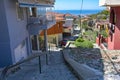 Narrow footpath in Ani Poli, the historic upper old town of Thessaloniki, Greece, with stone paved stairs down to the city center Royalty Free Stock Photo