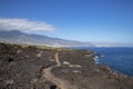 Narrow footpath through the arid badlands of lava and volcanic rocks known as Malpais de Guimar, Tenerife, Spain Royalty Free Stock Photo
