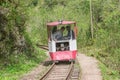 Narrow gauge railcar with the track workers in the Guam canyon. Western Caucasus Royalty Free Stock Photo