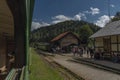 Narrow gauge railway in Majdan station with summer passengers in Poland Royalty Free Stock Photo