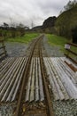 Narrow gauge railway tracks leading into distance