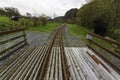 Narrow gauge railway tracks leading into distance