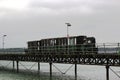 The narrow gauge train that runs the length of the Hythe Pier carrying passengers to and from the ferry boat to Southampton taken