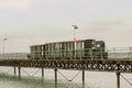 The narrow gauge train that runs the length of the Hythe Pier carrying passengers to and from the ferry boat to Southampton taken