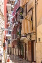 Narrow italian street with balconies, drying clothes and bike. Traditional mediterranean architecture. Italian town landmark.