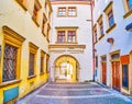 The narrow lane with a gates in a maze of medieval streets in old town of Brno, Czech Republic
