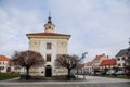 Narrow medieval square with baroque and renaissance historical buildings, Chapel of the Holy Family in sunny winter day, Benatky Royalty Free Stock Photo