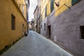 Narrow medieval street in Siena, Italy Royalty Free Stock Photo