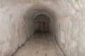 Narrow medieval tunnel made of bricks Royalty Free Stock Photo