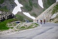 Narrow mountains road from Col de Lautaret to Col du Calibier, Mountains and alpine meadows views of Massif des Ecrins, Hautes Royalty Free Stock Photo