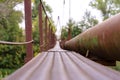 A narrow old rusty river crossing, along with a water and gas pipe. Communications in the village