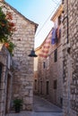 Narrow old street in Jelsa town, Hvar, Croatia Royalty Free Stock Photo