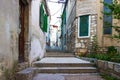 Narrow old streets and yards in Sibenik city, Croatia Royalty Free Stock Photo