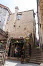 Narrow Old Town street. Medieval stone architecture. Souvenirs shop.