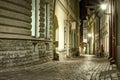 Narrow old town street of Tallinn, Estonia at night time. Stone Royalty Free Stock Photo