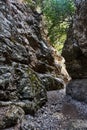 A narrow passage between the rocks of the Imbros Gorge on the island of Crete Royalty Free Stock Photo