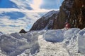 Narrow path in snow up high on Transfagarasan road, Romania, in Winter, with road signs almost buried in snow Royalty Free Stock Photo