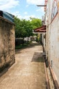 Narrow pathway behind the alley of Malaysian houses