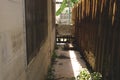 Narrow Pathway Between House and Wooden Fence Royalty Free Stock Photo