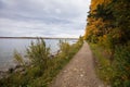 Narrow pathway on the shore of a lake in Riding Mountain National Park, Canada