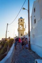 Narrow paved cliff top street and Greek church bell tower Imerovigli Santorini Royalty Free Stock Photo