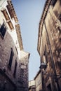 Narrow pedestrian alley between old houses in an old town in Europe