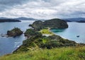 A narrow penÃ­nsula surraunded by ocean with cloydy sky on the Pacific ocean