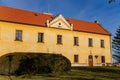 Narrow picturesque street with baroque and renaissance historical building with garden in Kladno in sunny day, Czech Republic