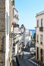 A narrow and picturesque street in the old town - alfama downtown