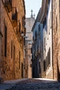 Narrow picturesque streets with medieval buildings in the old town of Caceres, Spain.