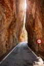 Narrow road cut through a mountain. Royalty Free Stock Photo