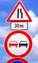 Narrow road and no overtaking traffic signs