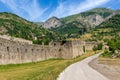 Narrow road and old military fort in the mountains in Italy