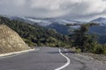 A narrow, rural road in the mountains